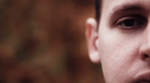 Young attractive man looking at camera Stock Footage 68207374