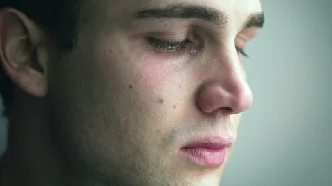 Young attractive man sad cries. Broken heart, disappointment, suffering Stock Footage 91071744