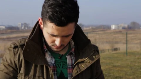 Young attractive man setting up a drone Stock Footage 91036532