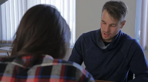 Young attractive man in a tracksuit explaining a business analysis Stock Footage 57335021