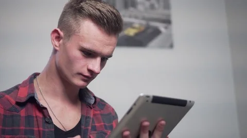 Young Attractive Man Use Tablet Computer Stock Footage 70101975