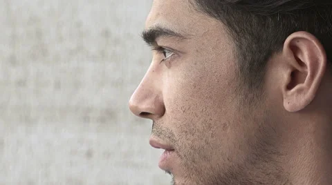 Young attractive man waiting for something: side portrait  Stock Footage 66671870