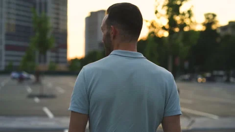 The young attractive man is walking outdoor. slow motion Stock Footage 138190859