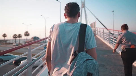 Young attractive man is winking under sunglasses. Handsome and cool guy. Stock Footage 112880323