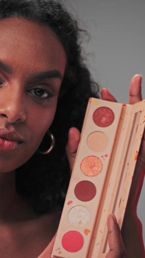 Young attractive model showing a set of cosmetics Stock Footage 307900157