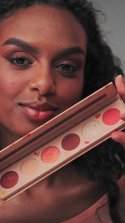 Young attractive model showing a set of cosmetics Stock Footage 340314265