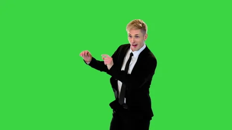 Young attractive office worker walks in a funny way on a Green Screen, Chroma Stock Footage 219463464