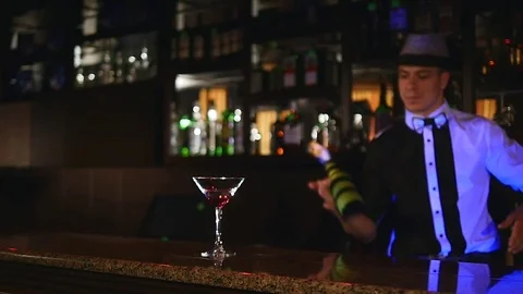 Young, attractive professional barman, bartender making cool, professional Stock Footage