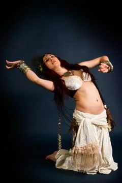 Young attractive retro model in old-fashioned wild clothing dancing Stock Photos