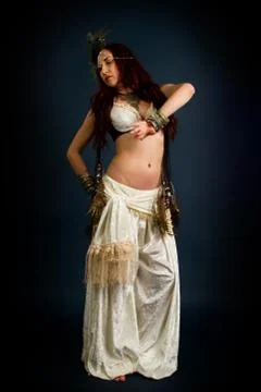 Young attractive retro model in old-fashioned wild clothing dancing Stock Photos