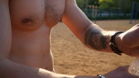 Young attractive strong guy portrait drink clean water from bottle after workout Stock Footage 75302814