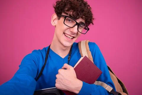 Young attractive student with a book. Stock Photos