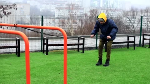 Young attractive stylish boxer man training with sport cord kit outside on sport Видео 166086643