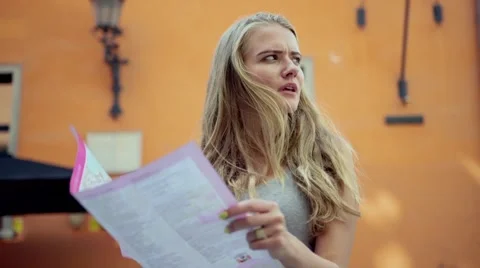 Young attractive tourist using map during sightseeing. 動画素材 41480565