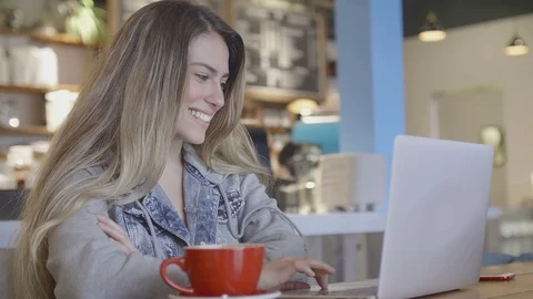 Young attractive woman in a cafe Stock Footage