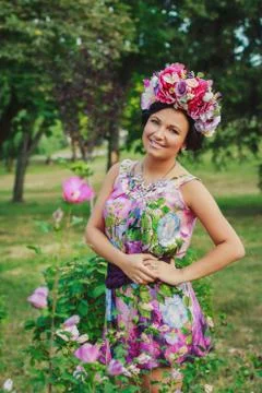 Young attractive woman with coronet of flowers Stock Photos