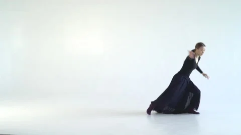 Young attractive woman dancing a dramatic dance on a white background. Contour Stock Footage 86233543