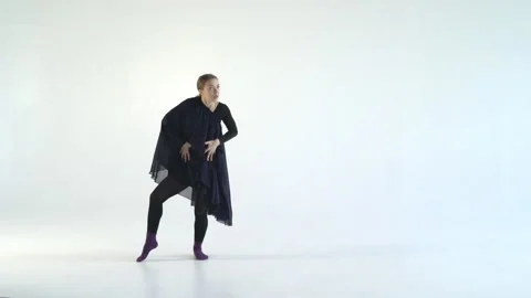 Young attractive woman dancing a dramatic dance on a white background. Contour Stock Footage 86234597