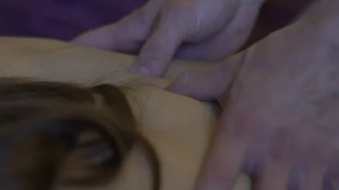 A Young Attractive Woman Receiving A Back Massage Slow Motion Stock Footage
