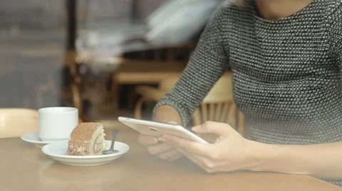 Young attractive woman with tablet computer sitting in cafe Stock-Footage 67512902
