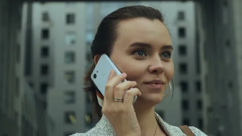 Young attractive woman talking on mobile phone. Close up portrait Stock Footage 141452257