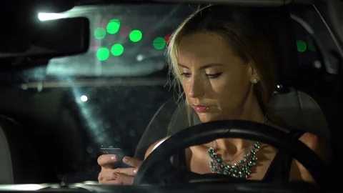 Young attractive woman using mobile phone in the car. Stock Footage 80252735