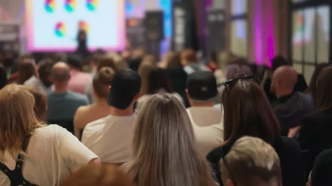 Young audience at a creative self-growth seminar, speaker with presentation out Stock Footage 270532703