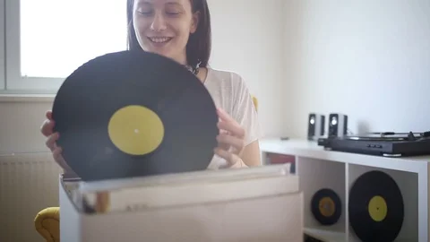 Young audiophile looking for vinyl record Stock Footage 89078053