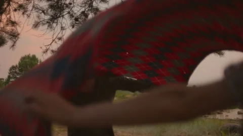 Young authentic couple sets up picnic blanket Stock Footage 168095804