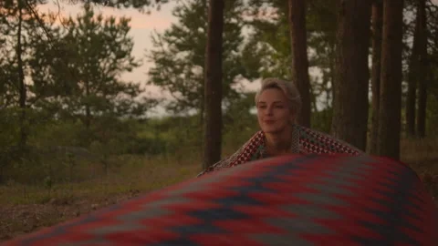 Young authentic couple sets up picnic blanket 動画素材 168095872