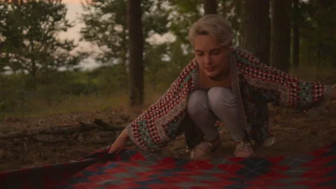 Young authentic couple sets up picnic blanket Stock Footage 168096014