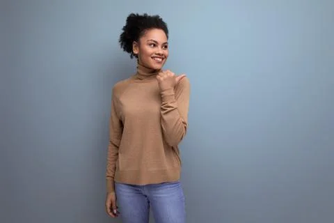 Young authentic hispanic lady with afro curly hair in casual clothes posing 스톡 사진
