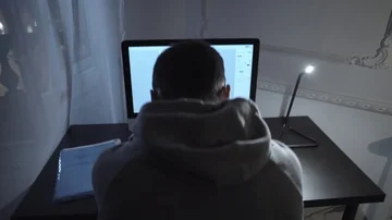 Young author struggling with script writing on computer at night in room Stock Footage 85706592