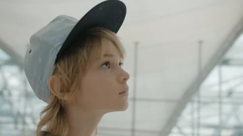Young backpacker checking flight information on digital schedule display Stock-Footage 104604003