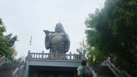 A young backpacker woman with camera exploring a temple in Asia Stock Footage 248514456