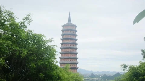 A young backpacker woman with camera exploring a temple in Asia Stock Footage 248514562