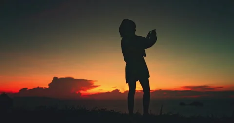 Young backpacker woman watching dramatic sunset in thailand Stock Footage 307300056