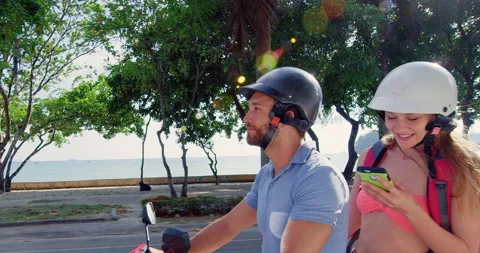 Young backpacking couple having a road trip together on hired Scooter in Ao Nang Stock Footage 201096861