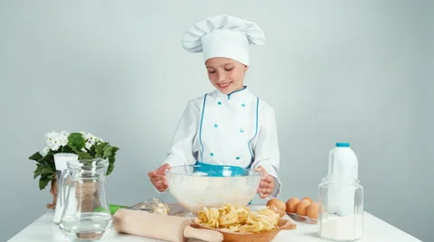 Young baker playing with dough and laughing at camera isolated on white Stock Footage