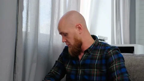 Young bald guy gives interviews, emotionally telling a story. Stock Footage 139192020