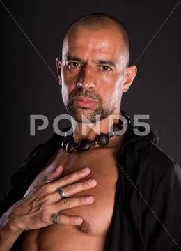 Young bald handsome man in black jacket Stock Photos