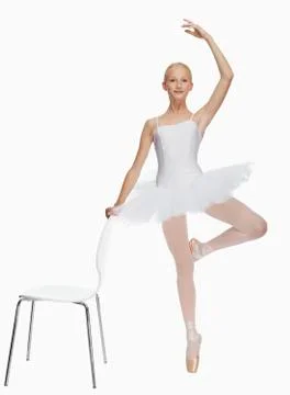 Young ballerina (14-15) standing on pointe in toe shoes,, portrait Stock Photos