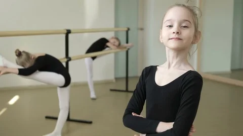 Young ballerina looking at camera and smiling Video stock 73895873