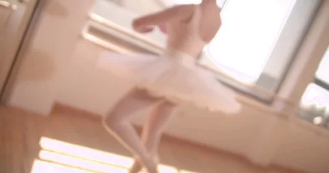 Young ballerina twirling while dancing in ballet studio Vídeos de archivo 80273858
