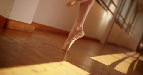 Young ballet dancer balancing en pointe in ballet pumps Stock Footage 80284338