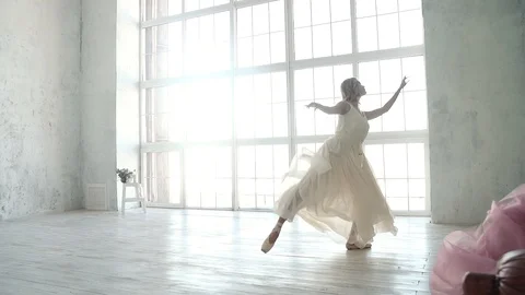 Young ballet dancer dancing on the background of a large window. ballerina in a Stock Footage 88363798