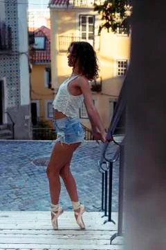 Young ballet dancer posing in the urban scenery of the city in Lisbon, Portug Stock Photos
