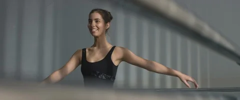 Young ballet dancer practice dancing or spinning in studio or dance hall Stock Footage 120516103
