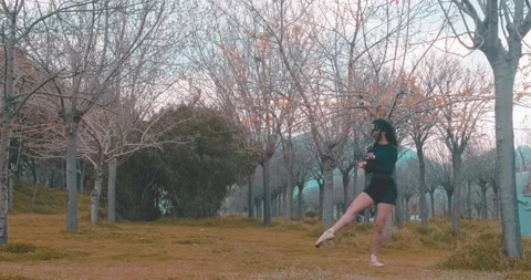 Young ballet doing exercise in outdoor, nature. Beauty professional ballerina Stock Footage 151610075