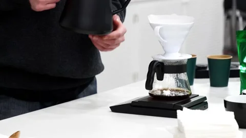 A young barista learns how to make aromatic coffee Stock Footage 232580642